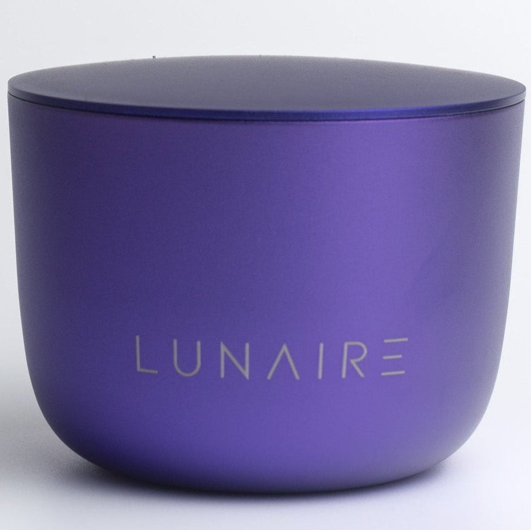 Purple aluminium candle jar with 'LUNAIRE' branding on a white background