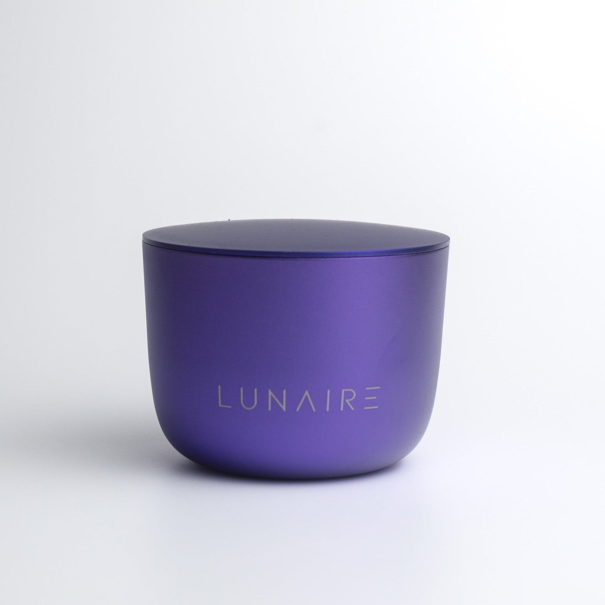 Purple aluminium candle jar with 'LUNAIRE' branding on a white background