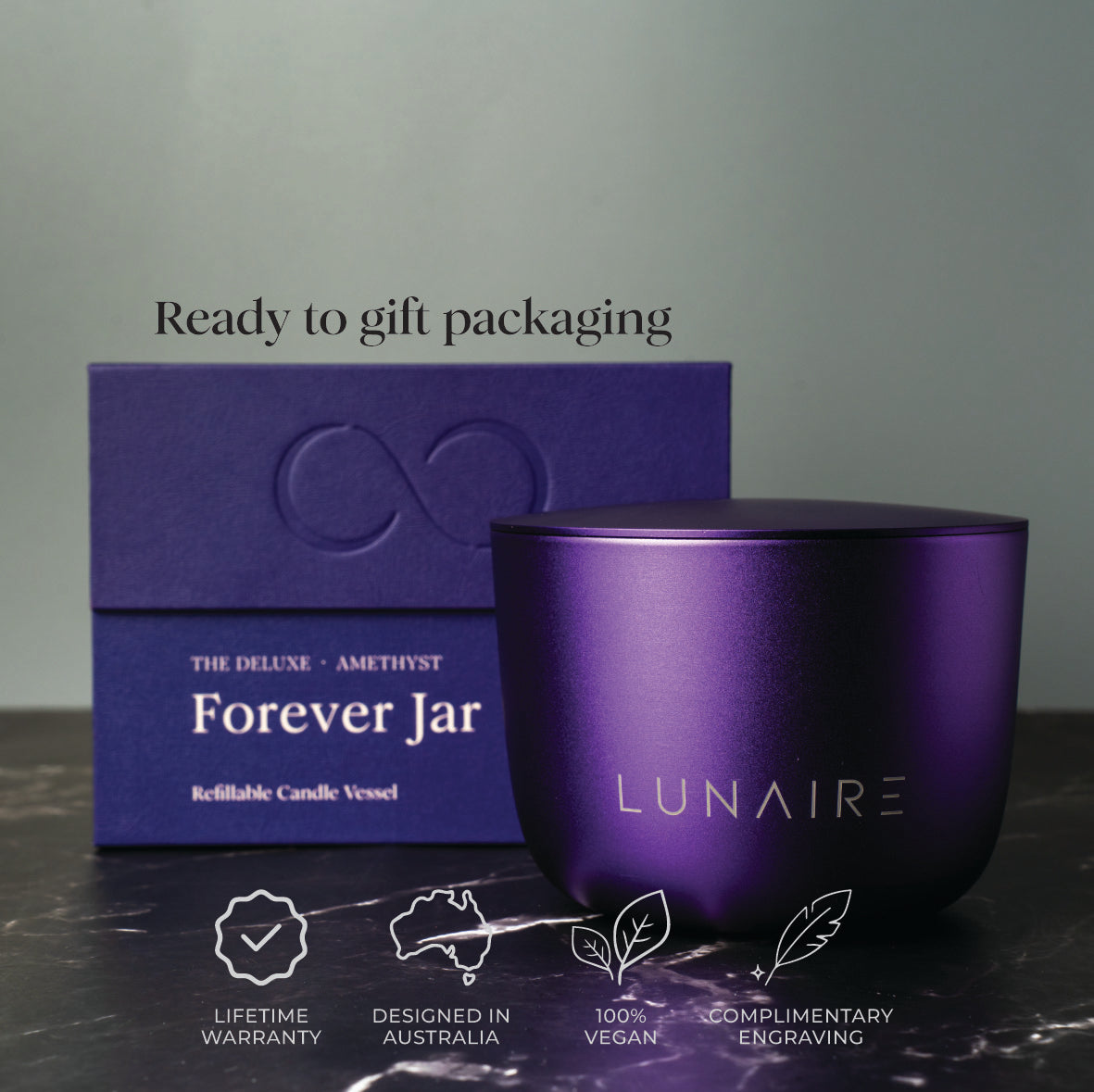 purple candle vessel with packaging labeled 'Forever Jar' and brand 'LUNAIRE' on a dark surface. Designed in Australia