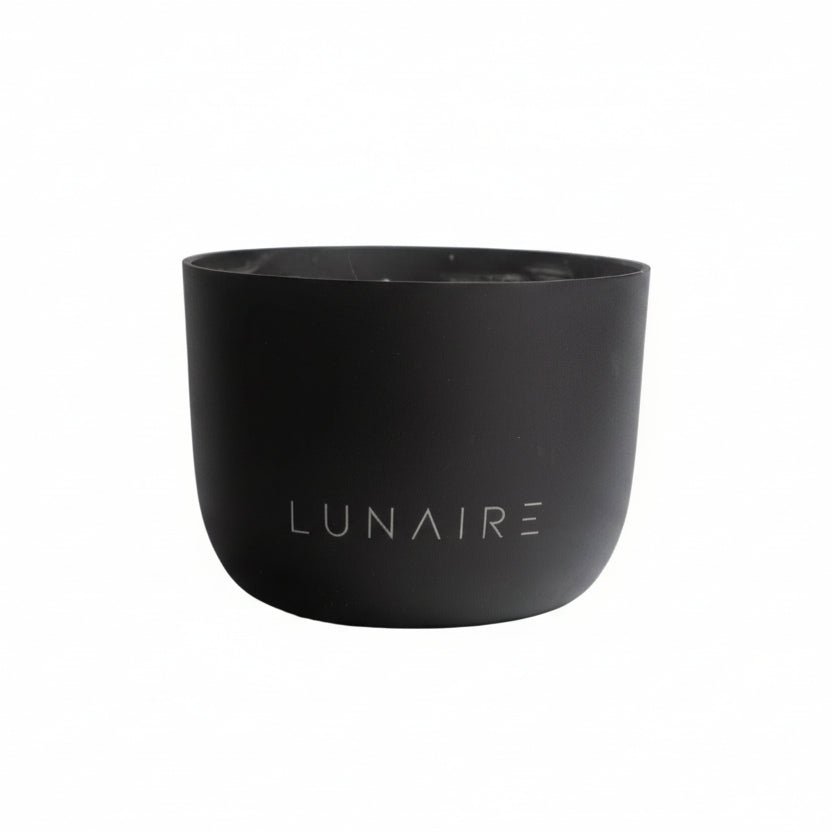 Black aluminium candle jar with 'LUNAIRE' branding on a white background