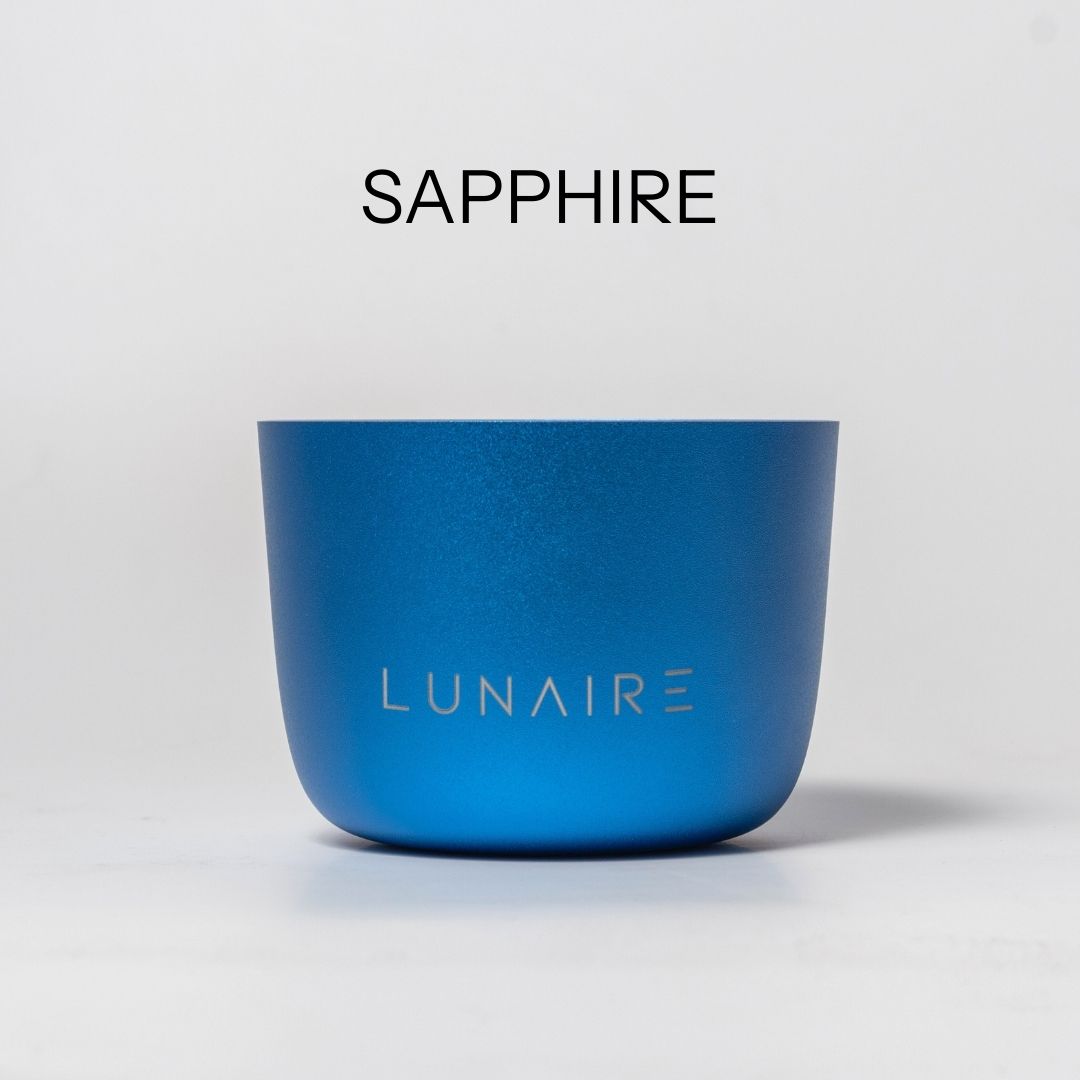 Blue candle jar labeled 'Sapphire' by 'LUNAIRE' on a white background