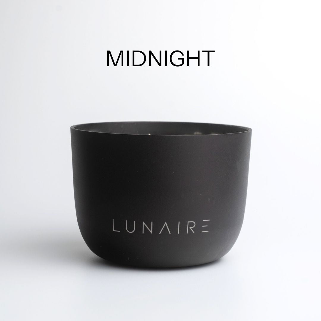 Black aluminium refillable candle with 'Lunaire' branding on a white background