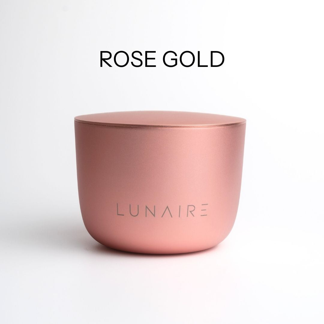 Rose gold aluminium forever candle with 'LUNAIRE' branding on a white background