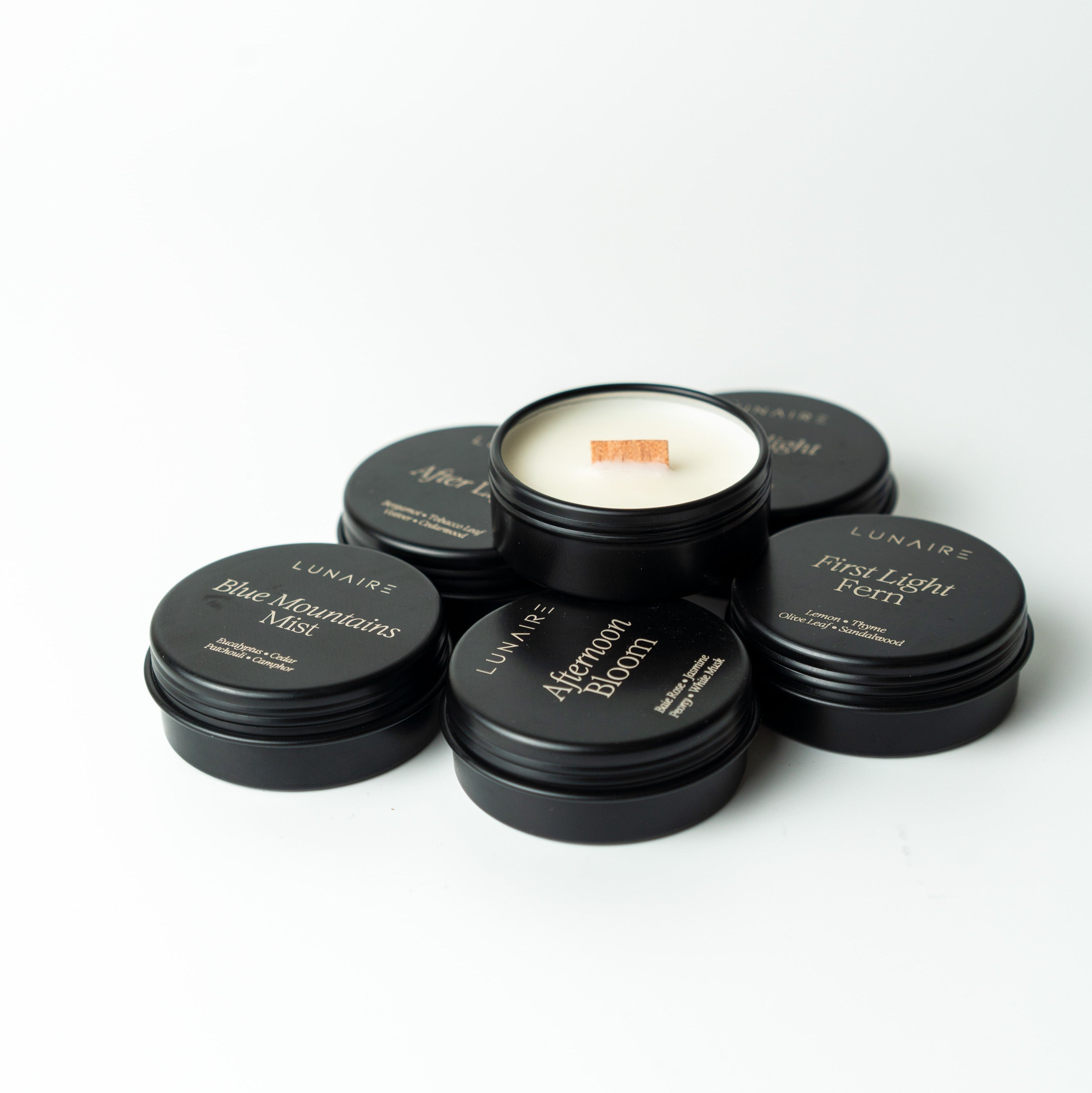 Set of black tealight candles soy vegan by lunaire on a white background