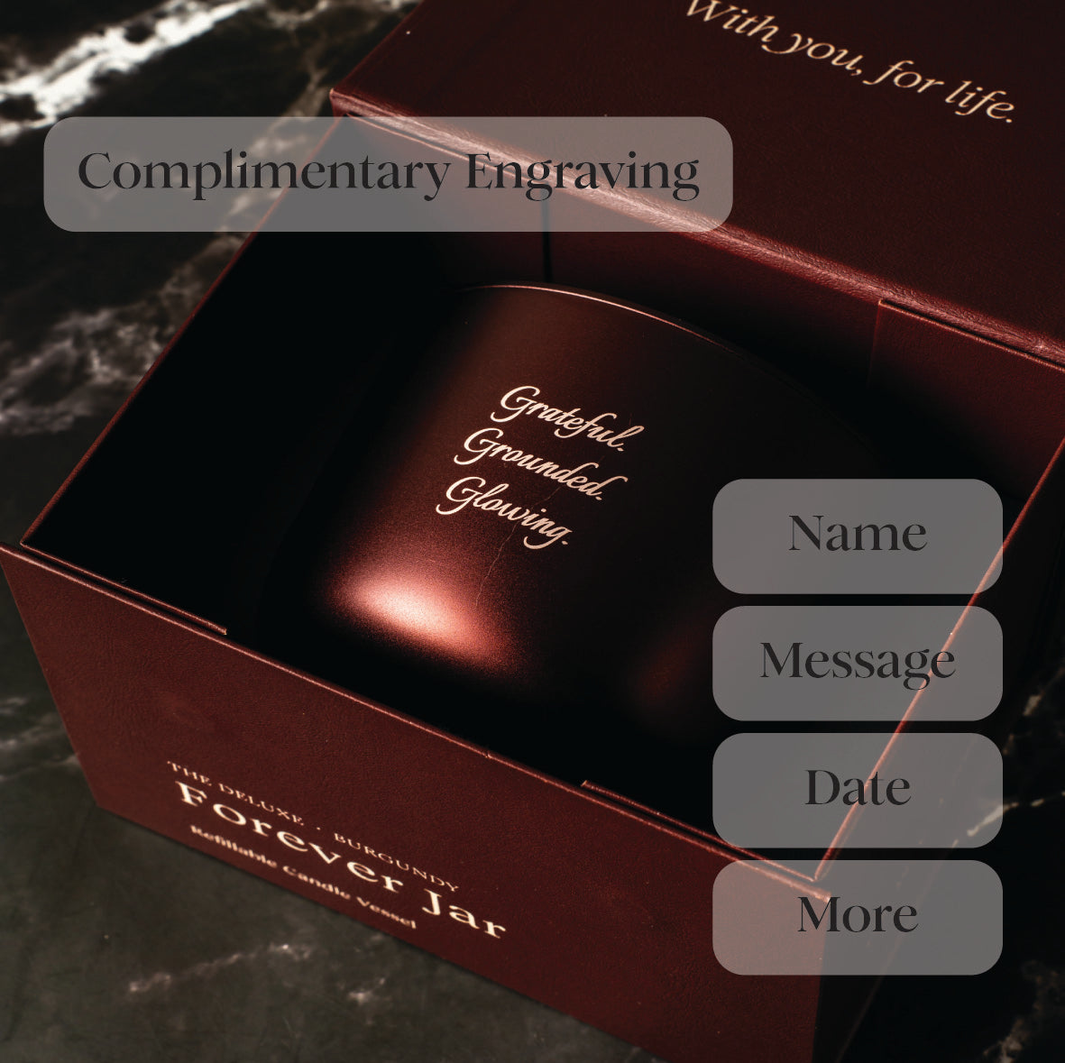 Burgundy Candle box with text 'Grateful, Grounded, Glowing' and options for engraving on a dark background. Luxury Candle Gift