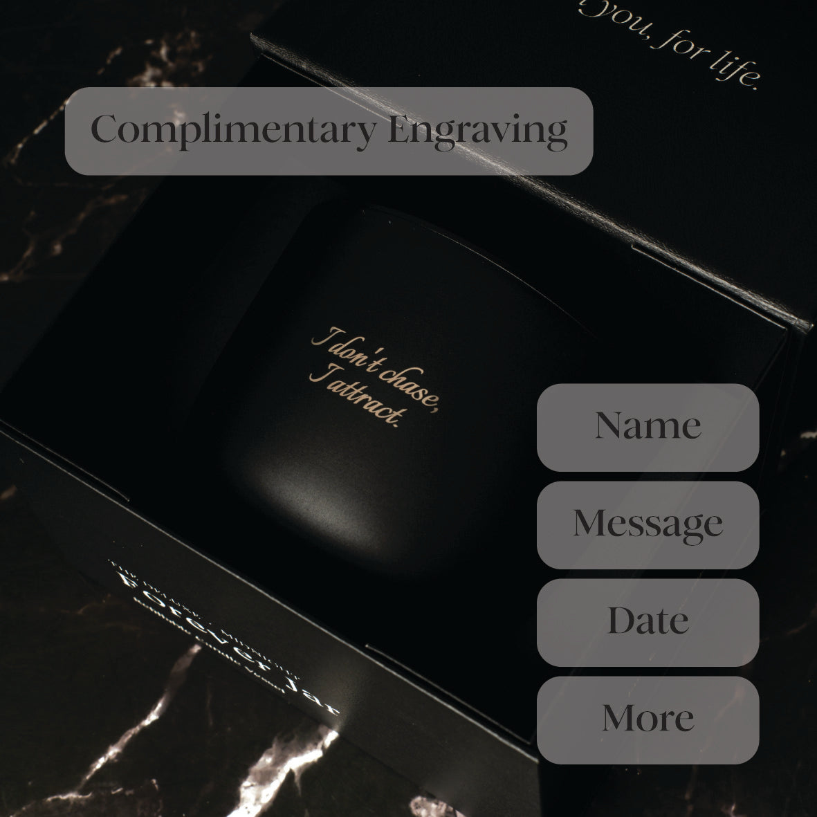 Black candle box with gold text and options for engraving on a dark background. complimentary engraving examples