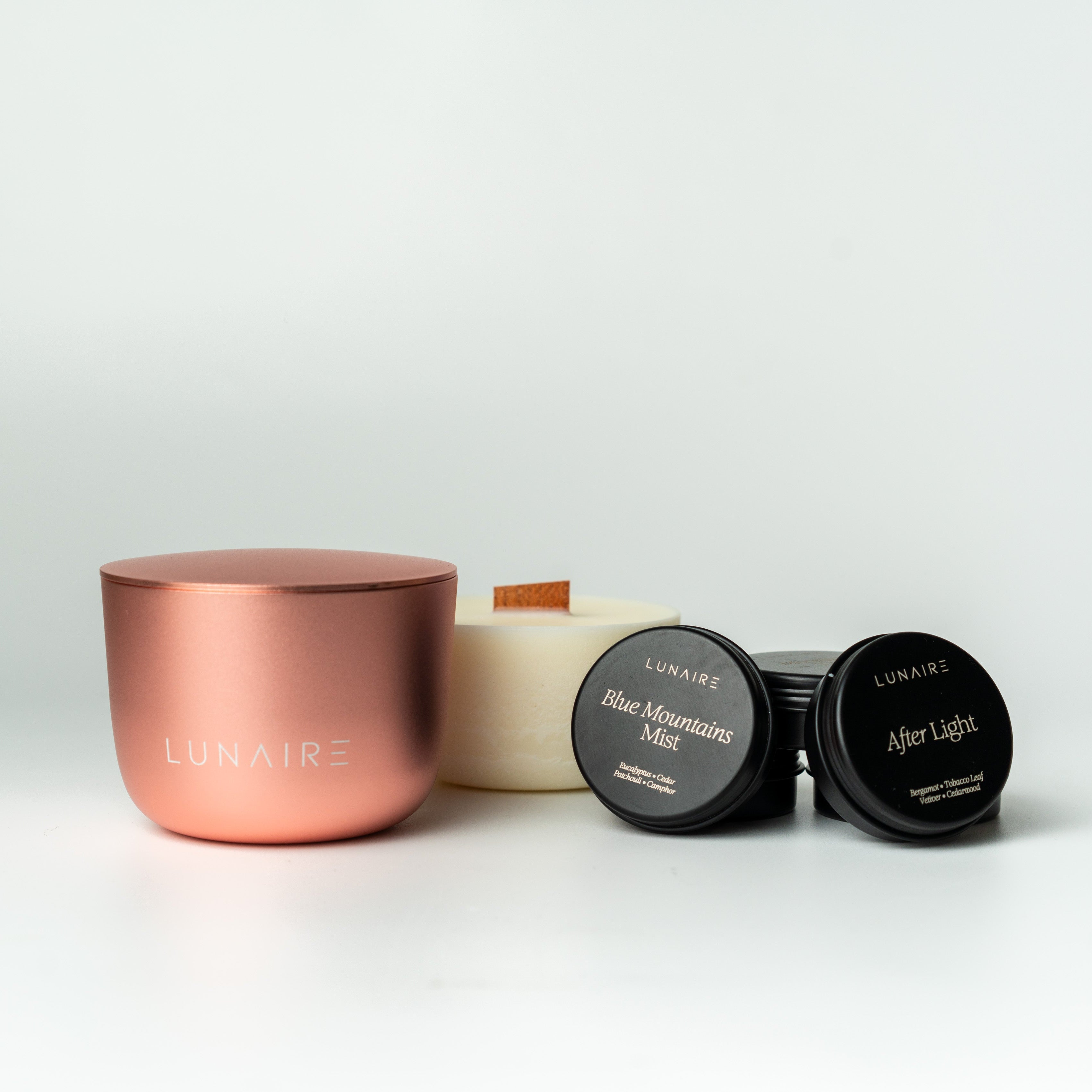 Lunaire soy candle refill with wood wick and tea light candles and rose gold forever jar made from aluminium