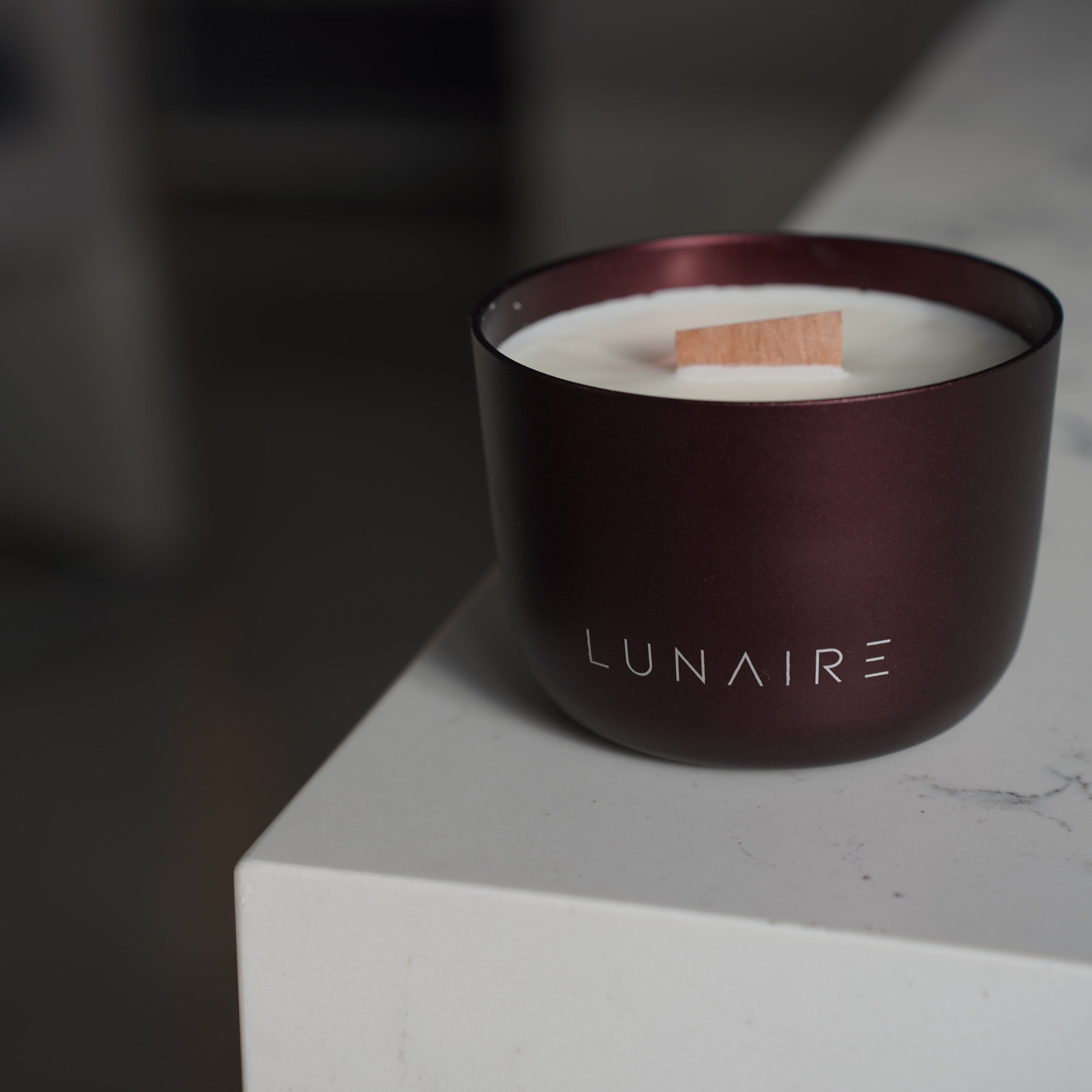 Burgundy Aluminium Candle on a luxury marble benchtop 