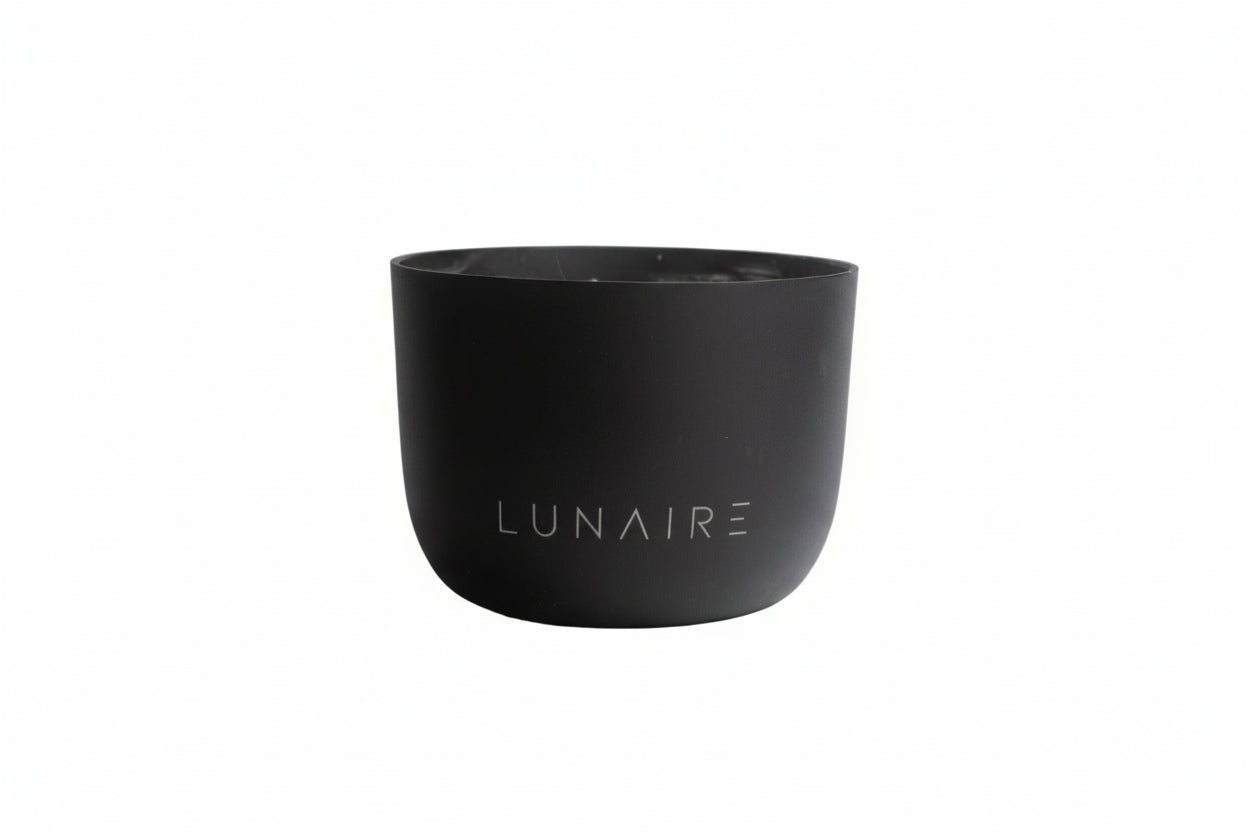 Black aluminium candle jar with 'LUNAIRE' branding on a white background