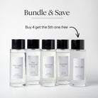 Five clear glass room spray bottles with black caps are lined up on a light gray background. Above them, text reads 'Bundle & Save' and 'Buy 4 get the 5th one free' with an arrow pointing to the rightmost bottle.