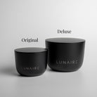 Two black containers labeled 'Original' and 'Deluxe' by LUNAIRE on a gray background.