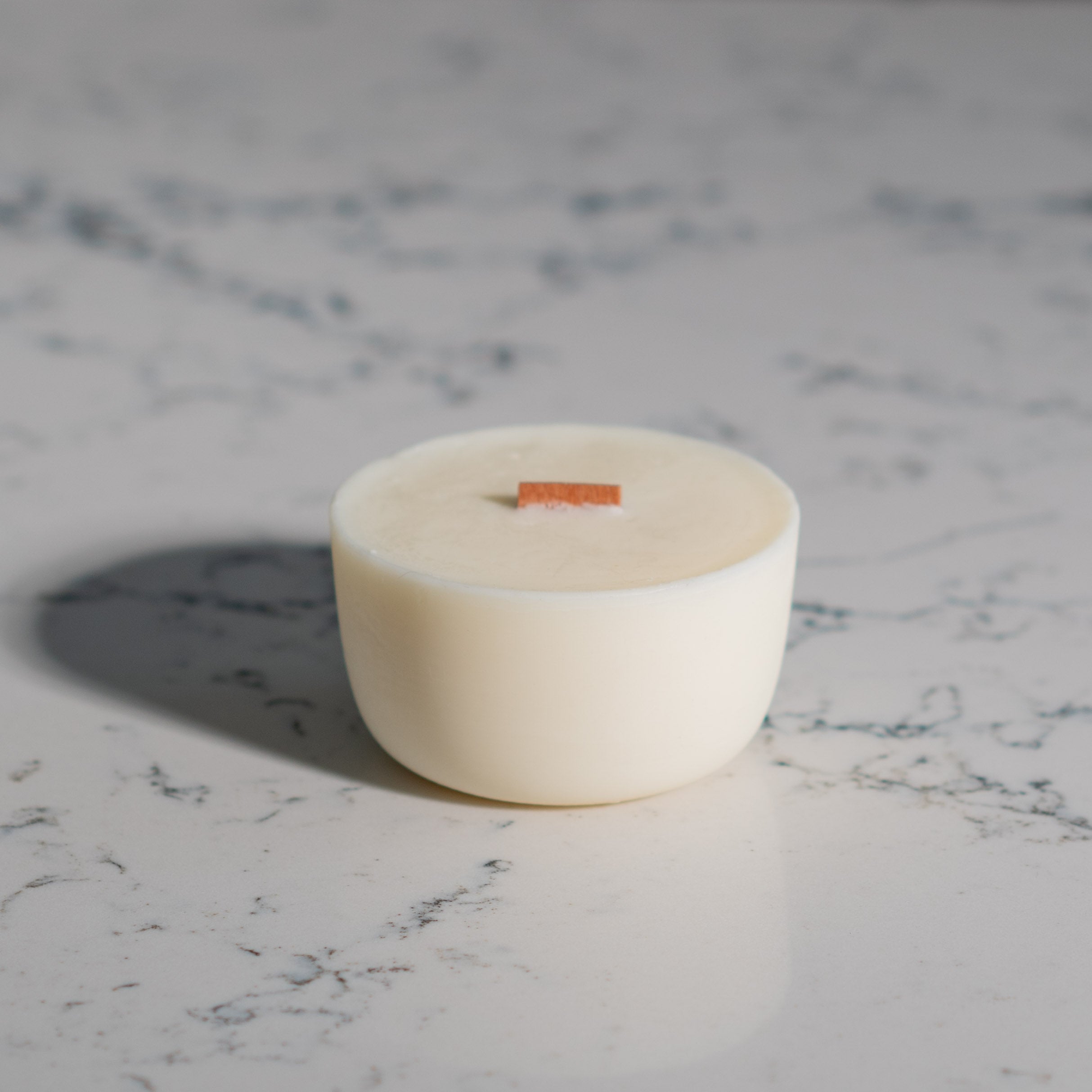 Lunaire Candle Refill on a marble top 