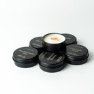 Set of black tealight candles soy vegan by lunaire on a white background