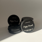 Black soy candles with 'Lunaire' branding on a gradient background